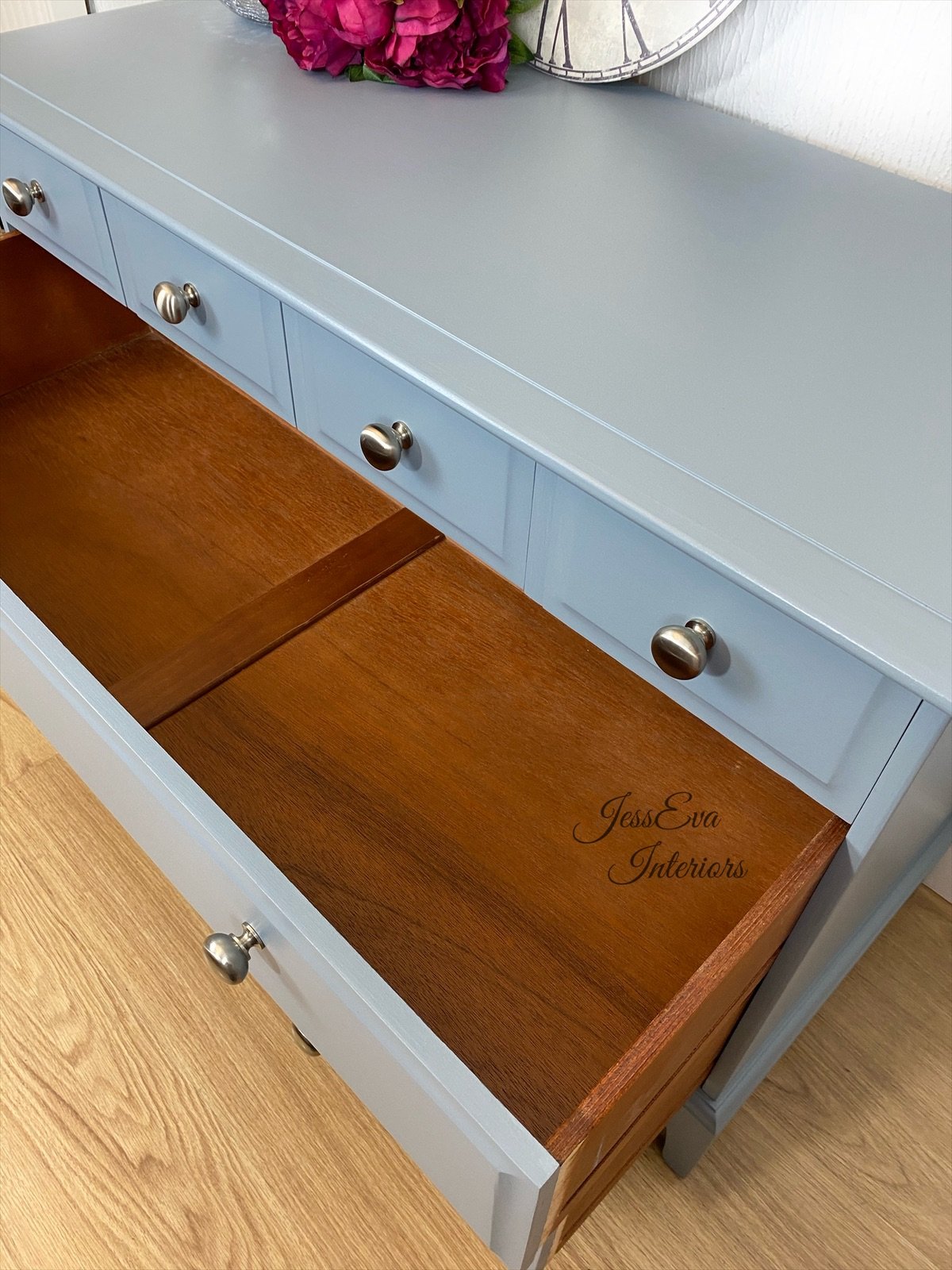 Stag Minstrel CHEST OF DRAWERS painted in light grey with blue tone.