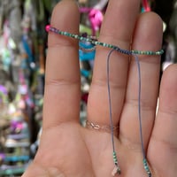 Image 3 of tiny stones and charm bracelet
