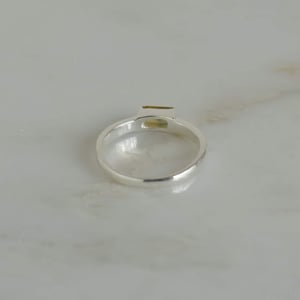 Image of Tanzania Yellow-Green Sapphire rectangular cut wide round band silver ring