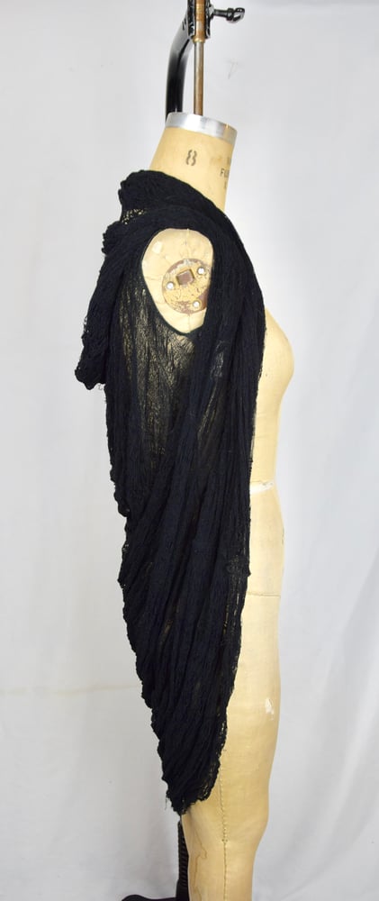 Image of Spider web cardi cape. 