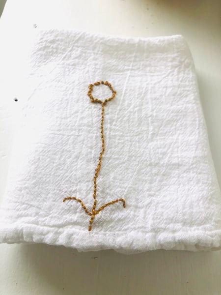 Image of botanica II gold embroidered flower towel