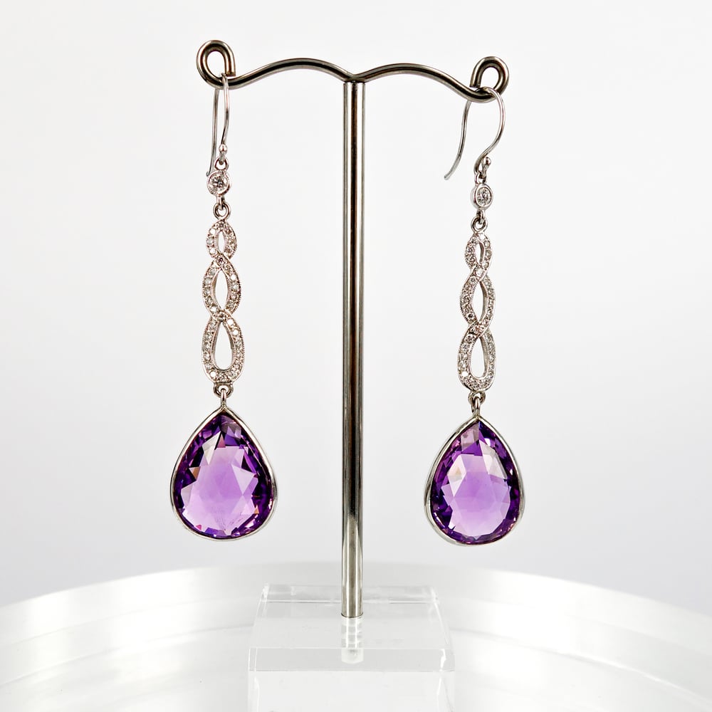 Image of Stunning platinum hand made diamond & Amethyst long drop earring.