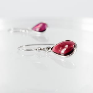 Image of Sterling silver garnet drop earrings. M3044