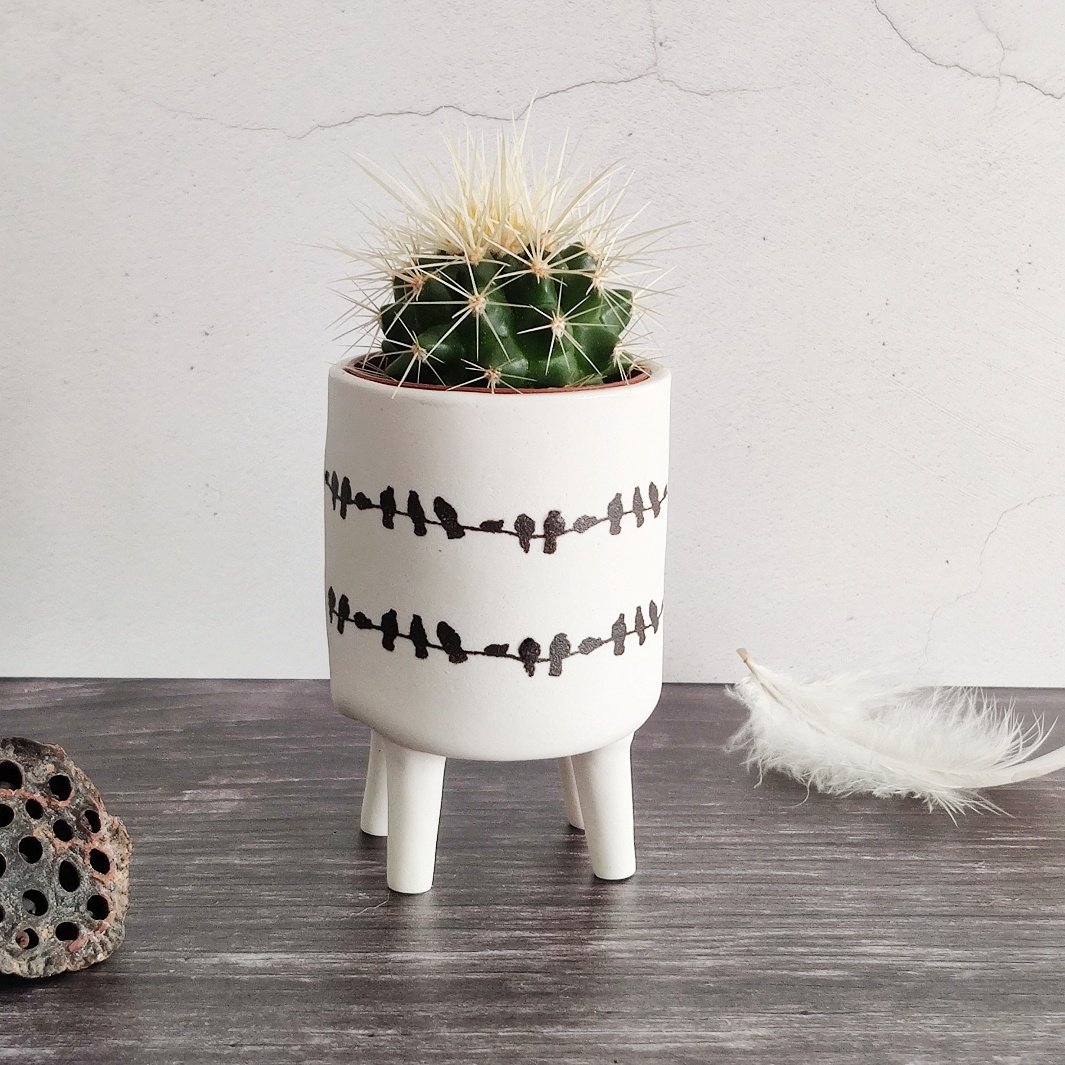 Porcelain birds on a wire four legged planter