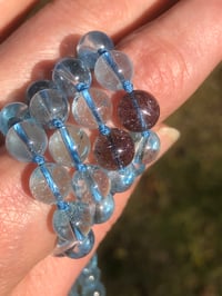 Image 4 of Blue Topaz Mala with Rare Super Seven Fireworks Pendant