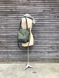 Image 1 of Waxed canvas leather tote bag in olive green with zipper closure and cross body strap
