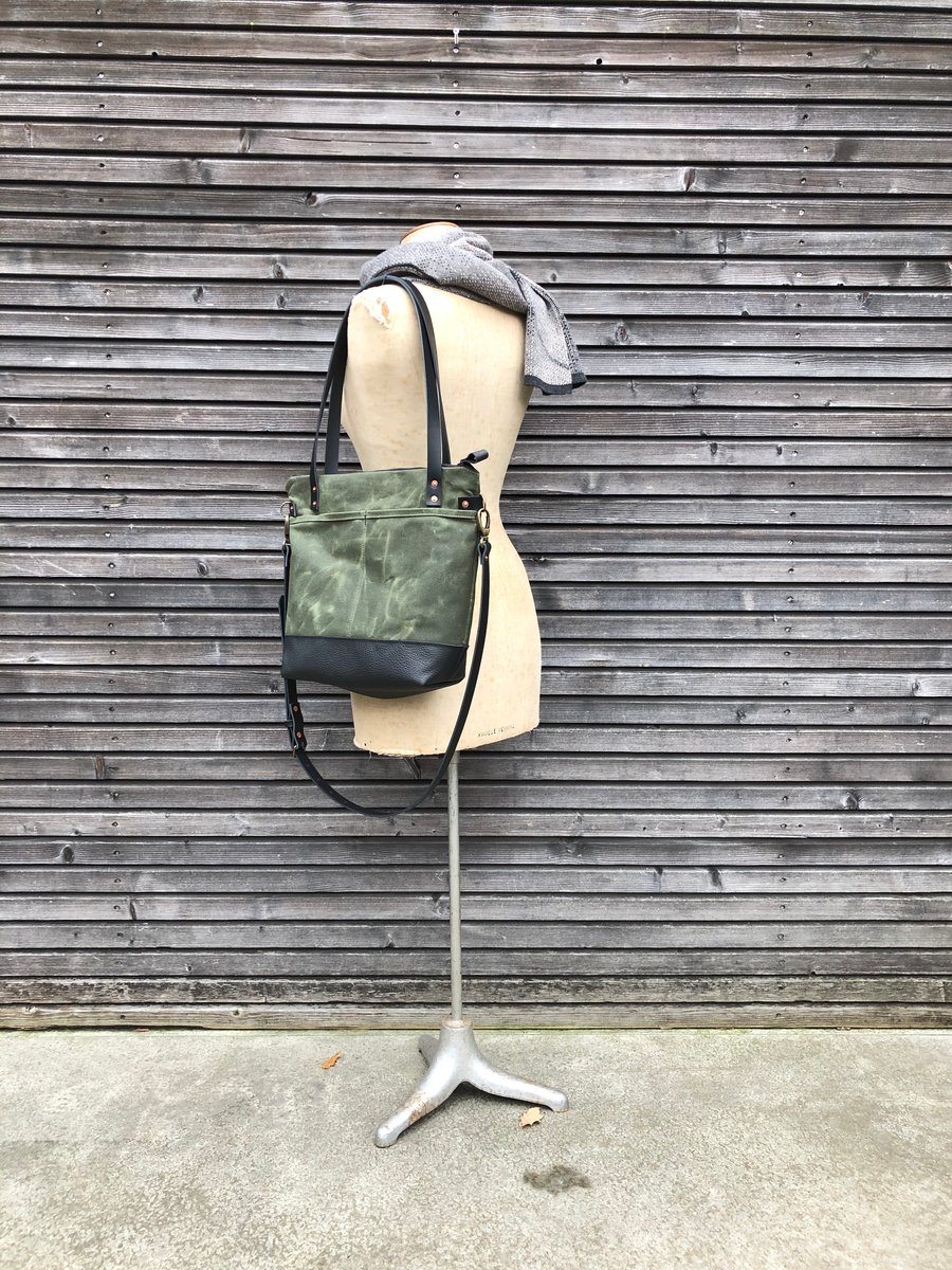 Carryall tote bag in olive green waxed filter twill with leather bottom and  cross body strap