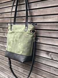 Image 2 of Waxed canvas leather tote bag in olive green with zipper closure and cross body strap