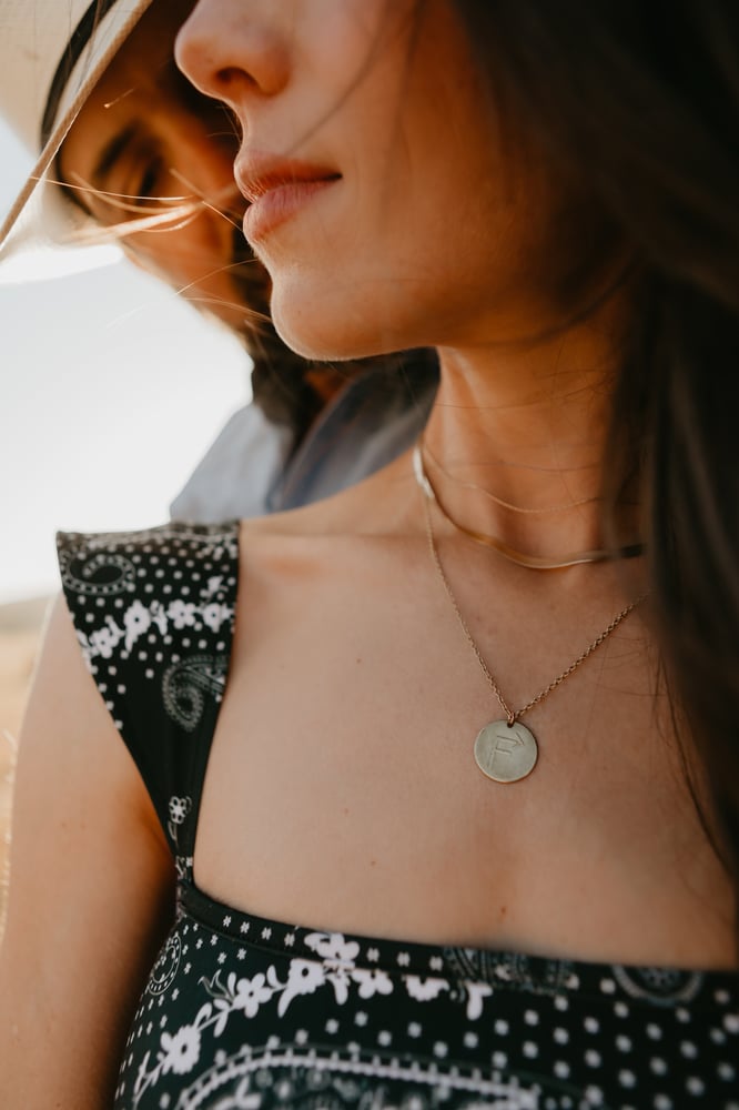 Image of Branded brass pendant 