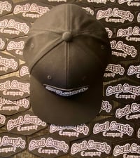 Image 1 of NORMAL BLK SNAP BACK LOGO HAT 