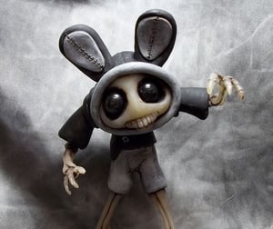Image of Scary Gary bag of bones Skeleton, with bunny ears polymer clay sculpture