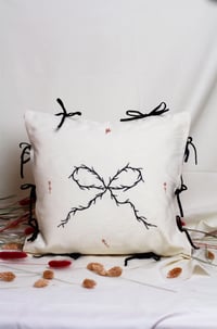 Thorn Bow Cushion