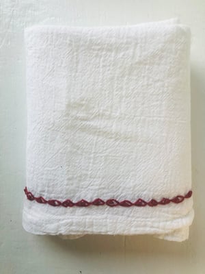 Image of scarlet red hand embroidered border towel 