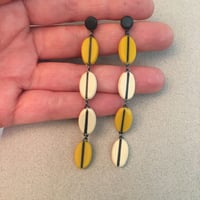 Image 3 of long yellow seed earrings