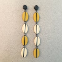 Image 1 of long yellow seed earrings