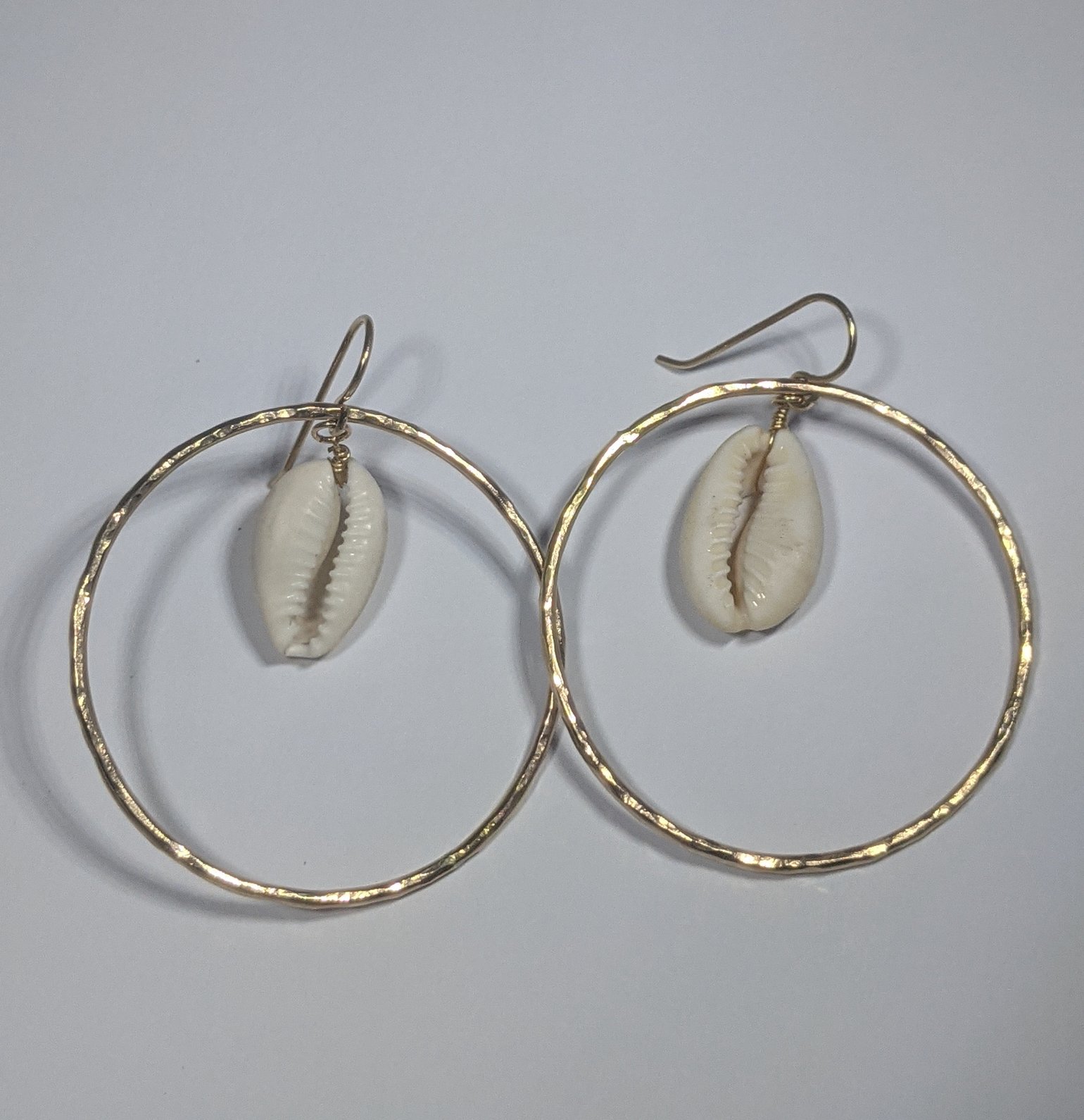 Image of Large gold cowrie hoops 