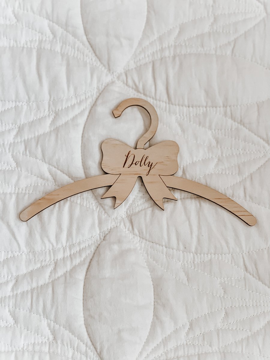 Image of Dolls coat hanger with ‘Dolly’ engraved 