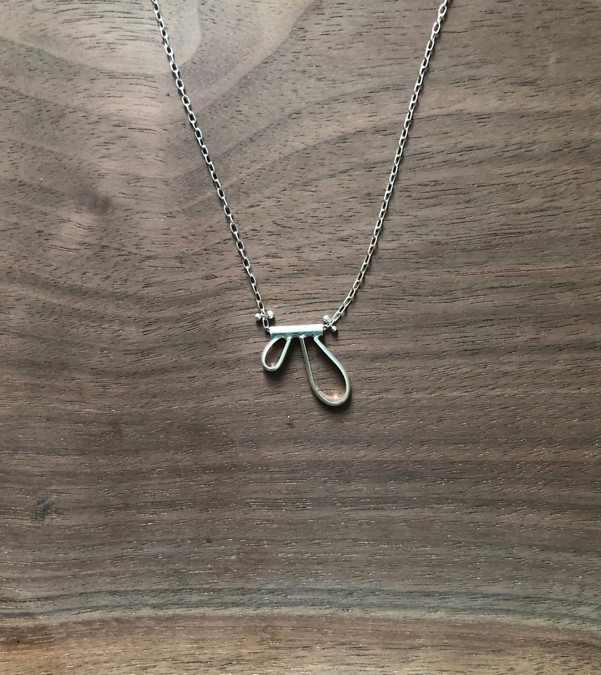 abstract silver wings necklace