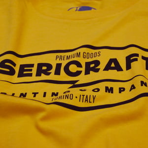 Image of SERICRAFT EMBLEM TEE - YELLOW