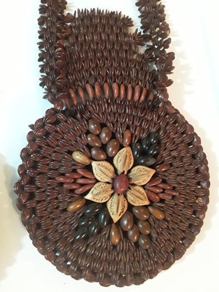 Image of Pocketbook made from beans and seeds