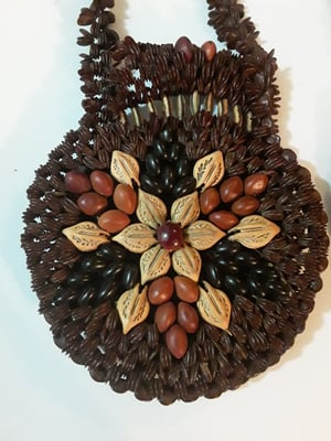 Image of Pocketbook made from beans and seeds