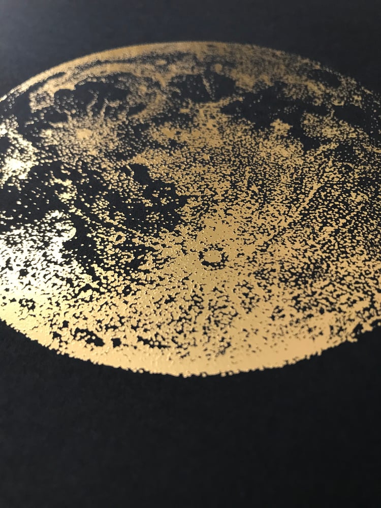 Image of Gold full moon on slate
