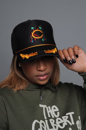 Image of Colbert klan Indian styled trucker hat. 