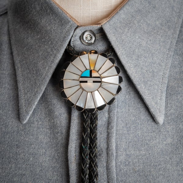 Image of Mother of Pearl Zuni Sun Face Bolo Tie signed by Zuni Silversmith TYC Inlay over Sterling Silver