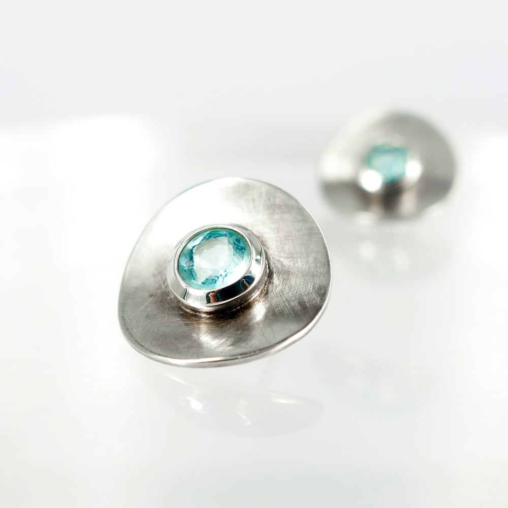 Image of Large sterling silver and blue topaz disc earrings. S/S1