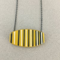 Image 1 of mustard graphic pendant