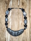 Black and grey carved bib necklace