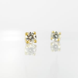 Image of 18ct yellow gold four claw diamond stud earrings. SH