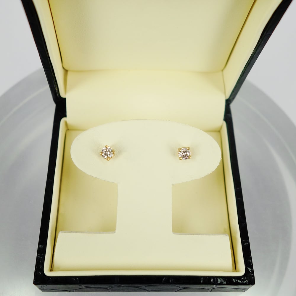 Image of 18ct yellow gold four claw diamond stud earrings. SH