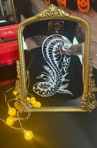 Sailor Jerry snake mirror