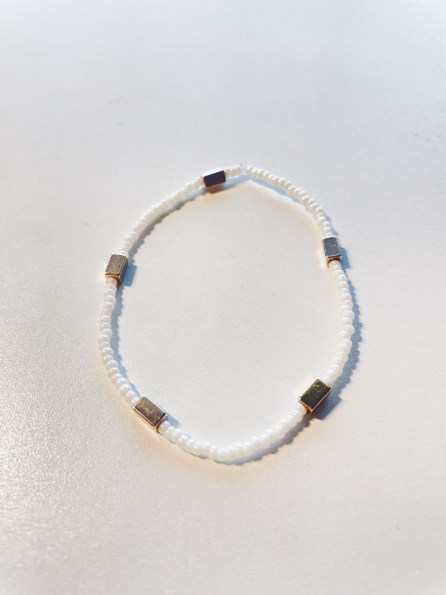 Image of pearly white and gold bracelet