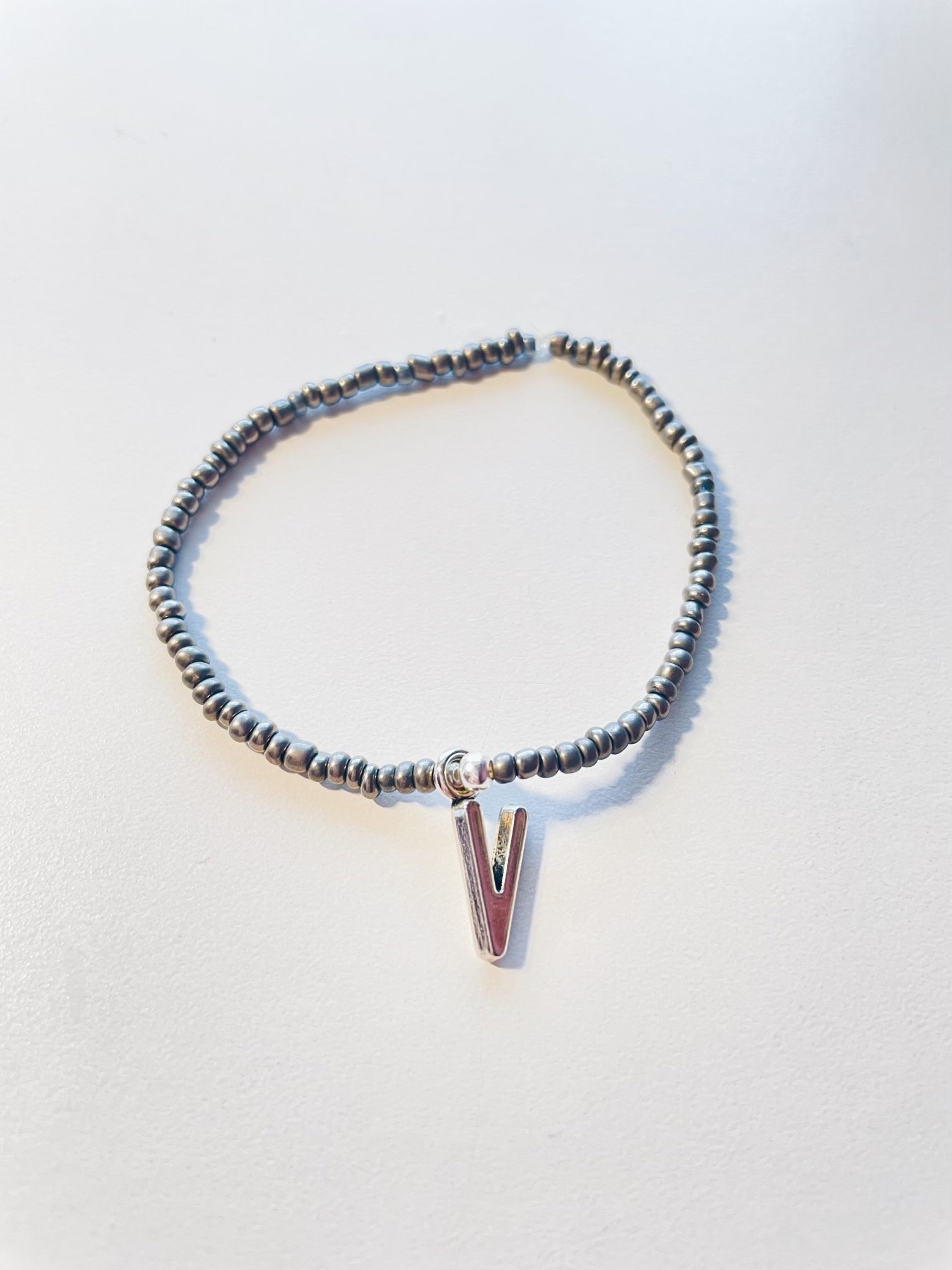 Image of metallic gray initial bracelet