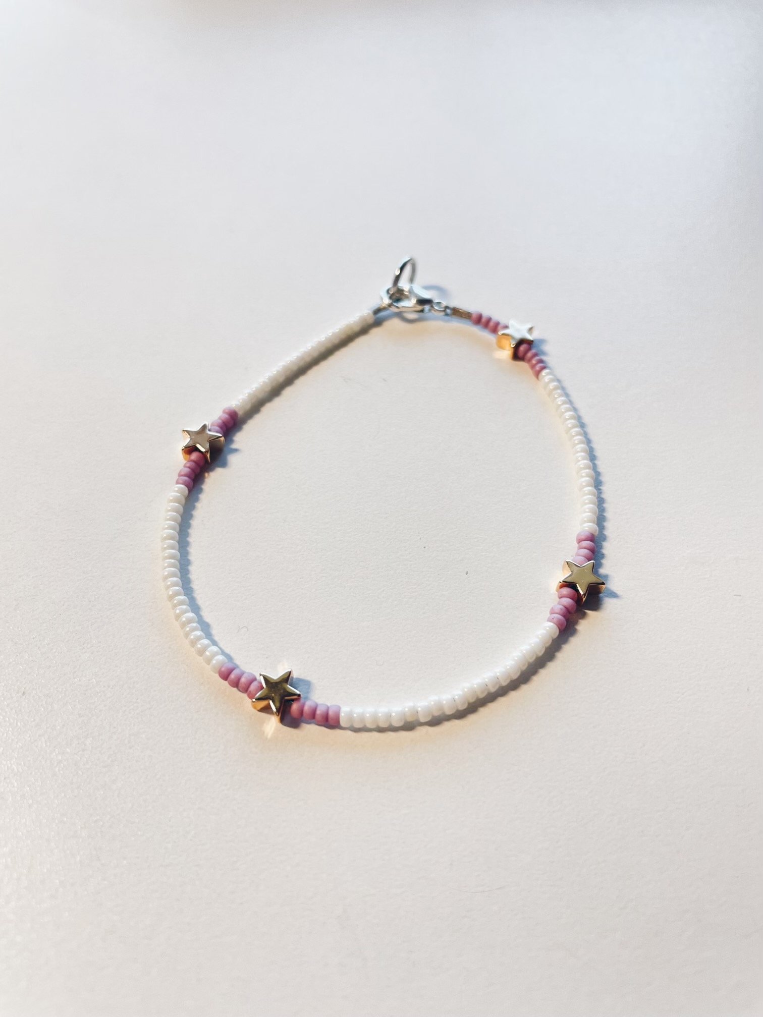 Image of pearly white & purple stars bracelet
