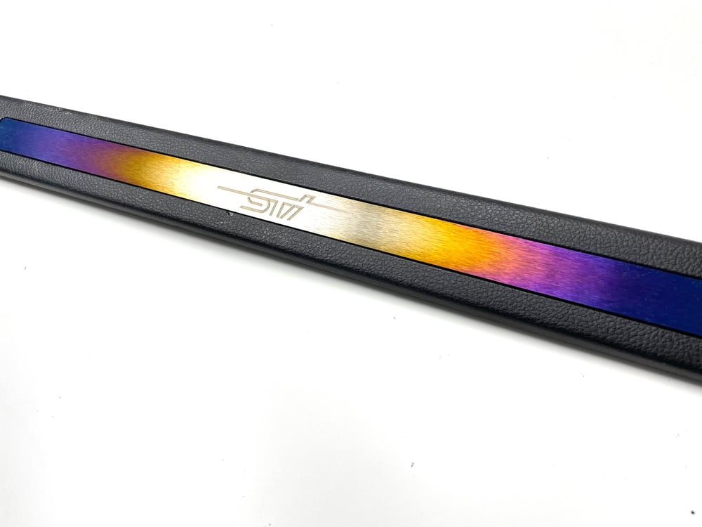 +15 Subaru STI titanium front door sill inserts.