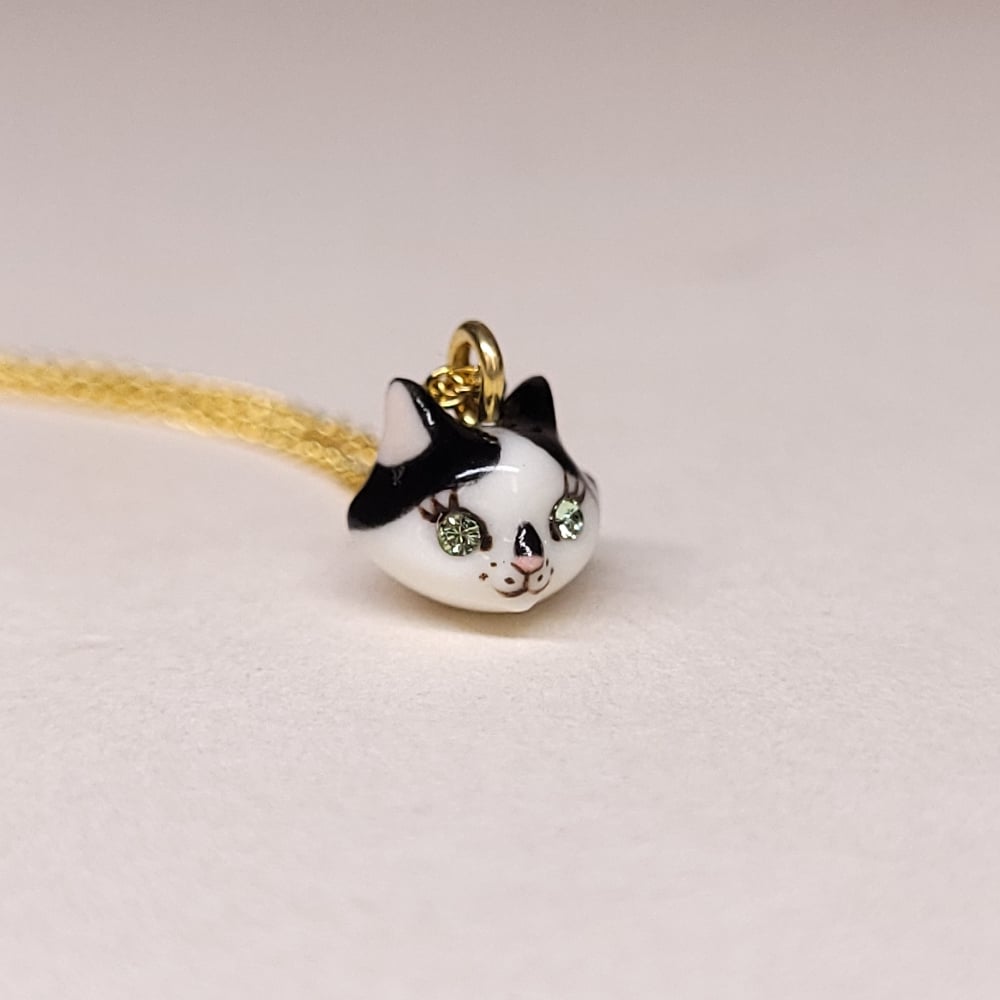 Image of Cow Cat Porcelain & Gold Vermeil Teeny Tiny Cat Pendant