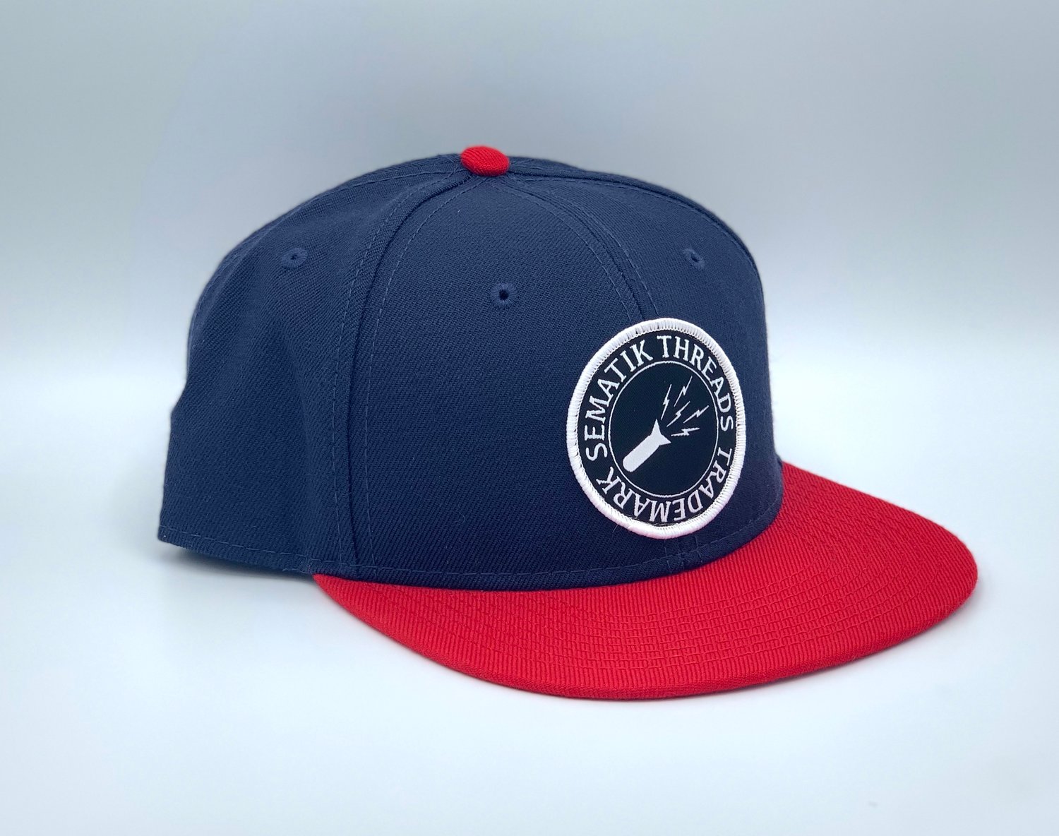 Image of SEMATIK LOGO SNAPBACK HAT - NAVY/RED