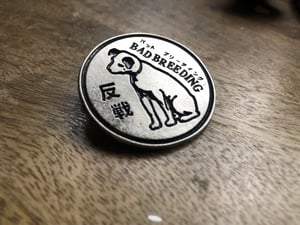 Image of Dove and Dog pin badges