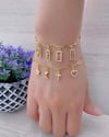 Four Charms in gold steel Bracelets