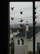 Image of paper crane chain of 5