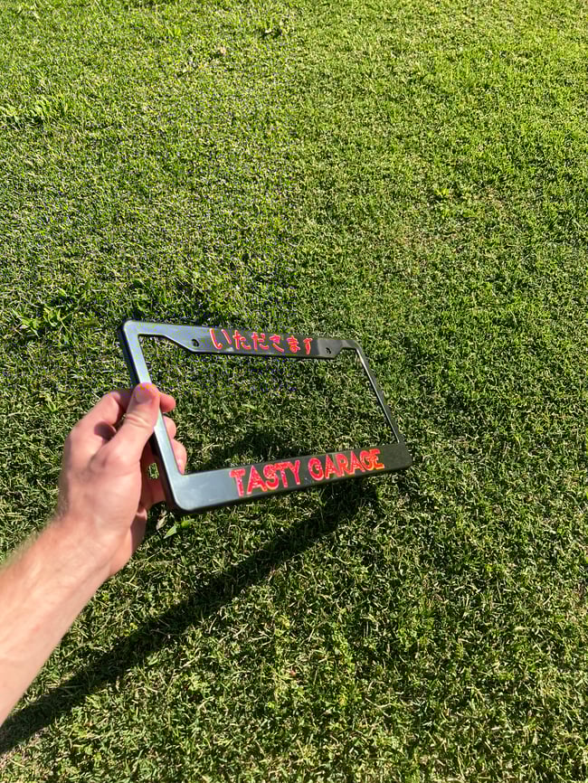 Red Tasty Garage License Plate Frame