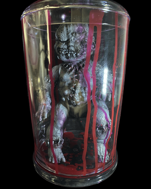 Image of Grayscale & blood Autopsy Baby (in jar)