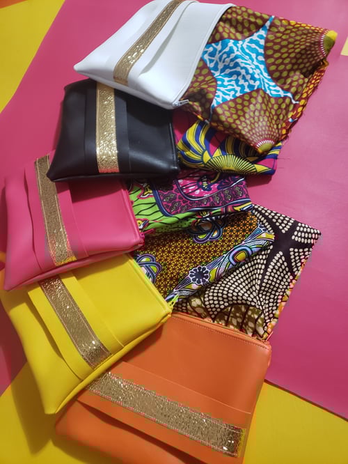 Image of Neon Orange Gold Clutch With Hand Strap