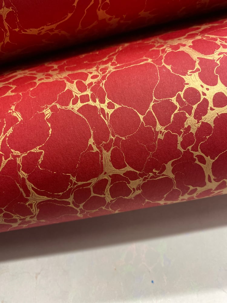 Image of Marbled Paper #30 'Gold Italian vein' hand marbled on red base paper