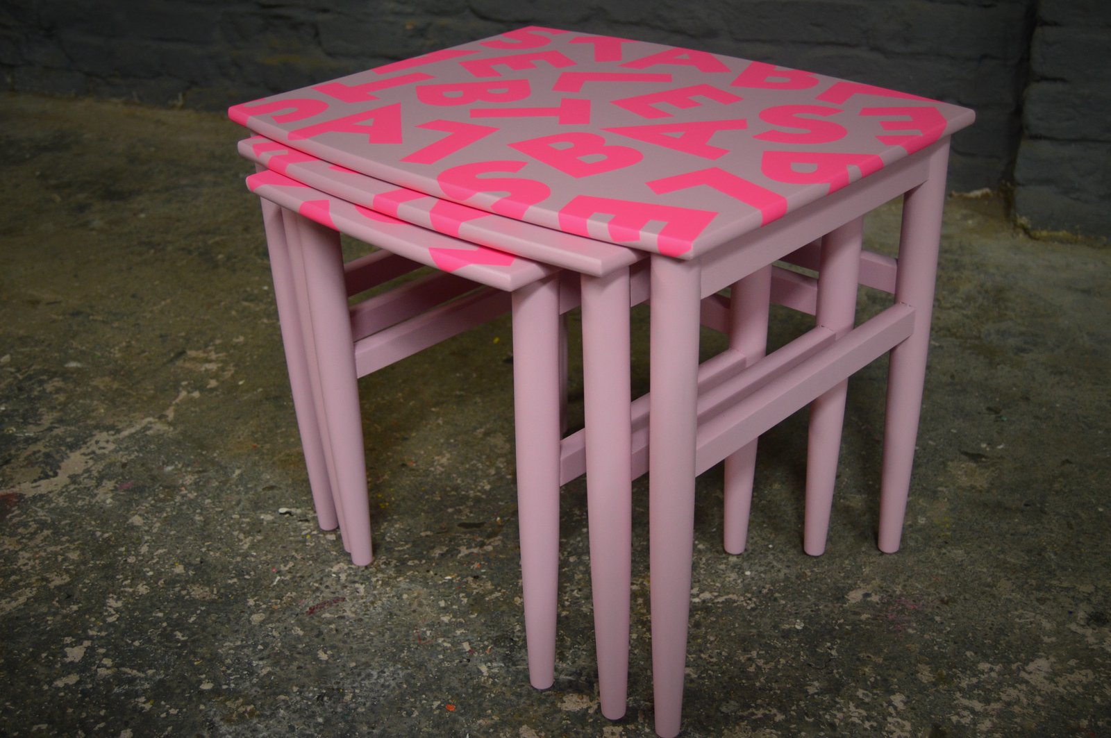 pink nest of tables