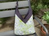 Sac Yvonne blue summer sky and green flowers