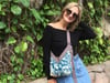 Sac Yvonne blue summer sky and green flowers